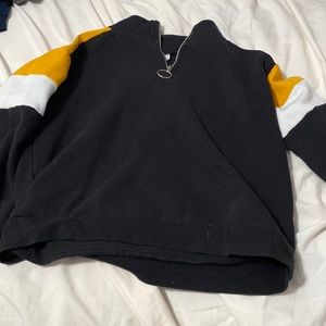 Black sweater with yellow and white sleeves